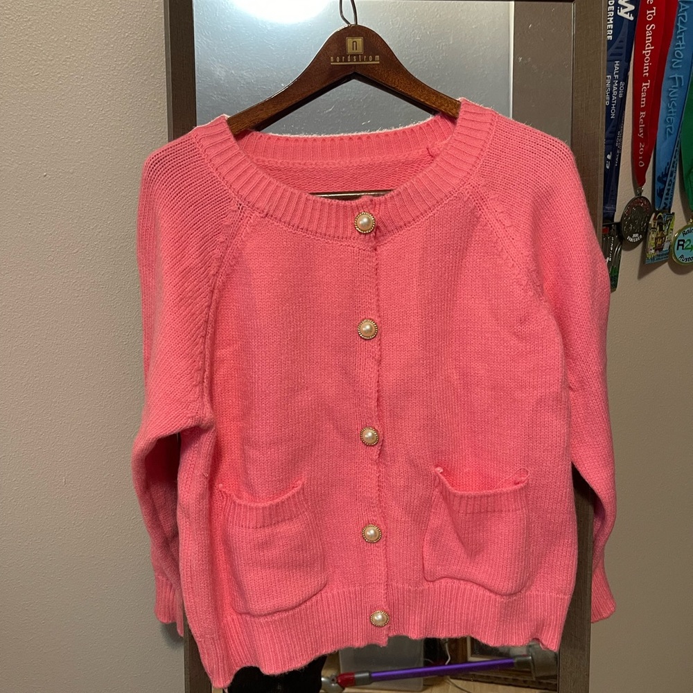 Chenille women’s sweater with faux pearl buttons.